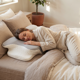 Woman sleeping peacefully on the Halden ergonomic contour support pillow