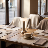 Halden Cordless Bar Lamp on a cafe table