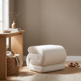 Halden S-Curve Velvet Ottoman in a warm entryway
