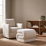 Halden S-Curve Velvet Ottoman in a living-room reading corner