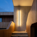 Halden IP65 Outdoor LED Wall Light on a modern exterior facade at dusk
