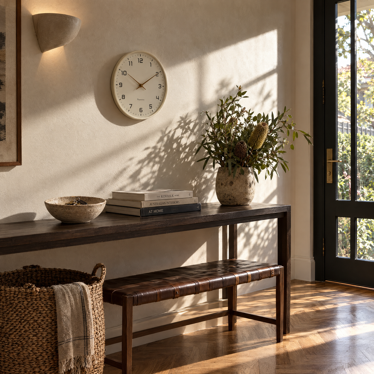 Creme silent wall clock above an entryway console