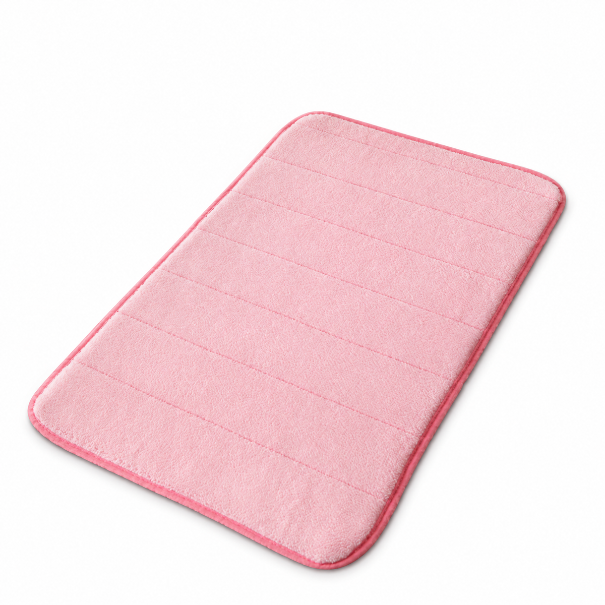 Plush anti-slip bath mat in pink on white background