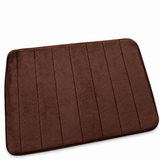 Plush anti-slip bath mat in brown on white background