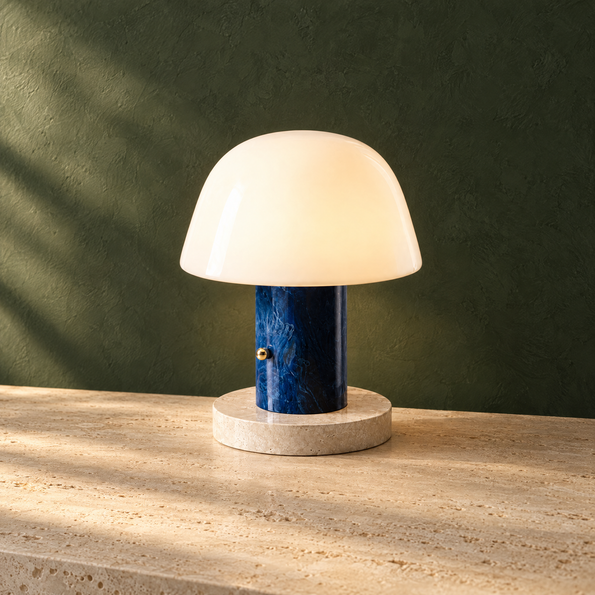 Blue rechargeable mushroom lamp glowing against a deep green wall