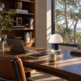 Blue mushroom lamp on a home office desk
