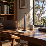 Grey cordless LED table lamp on a home office desk