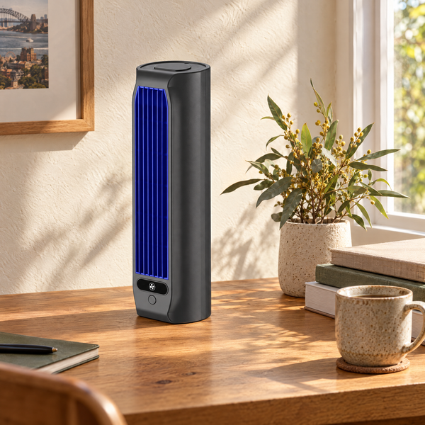 Rechargeable portable air cooler on a timber desk in a sunlit Sydney study