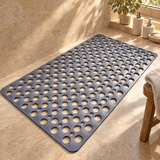 Anti-slip shower floor mat on a travertine shower floor