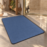 Quick-dry absorbent bath mat outside a glass shower