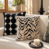 Rand tiger stripe cushion on a boucle sofa