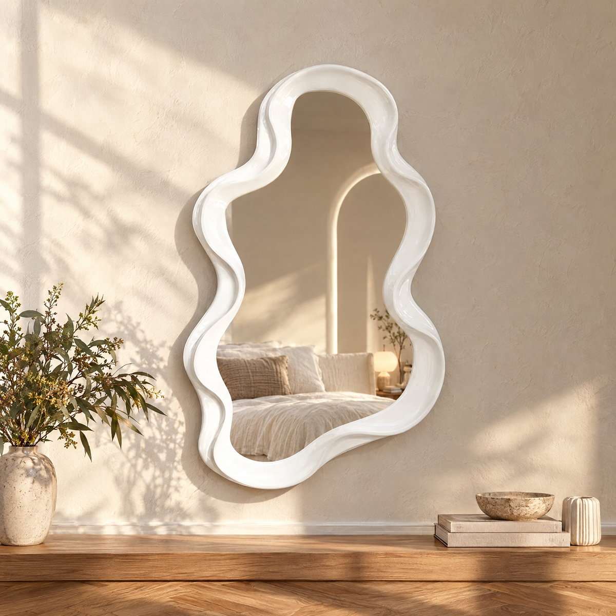 Moln cloud shaped mirror on a limewashed wall