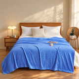 Blue waffle cotton summer bedspread on a timber bed