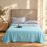 Aqua soft cooling blanket on a bed